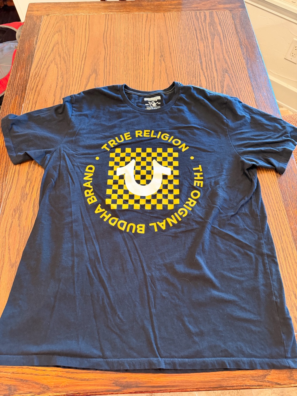 True Religion Black T‑Shirt with Yellow and White Graphic Logo
